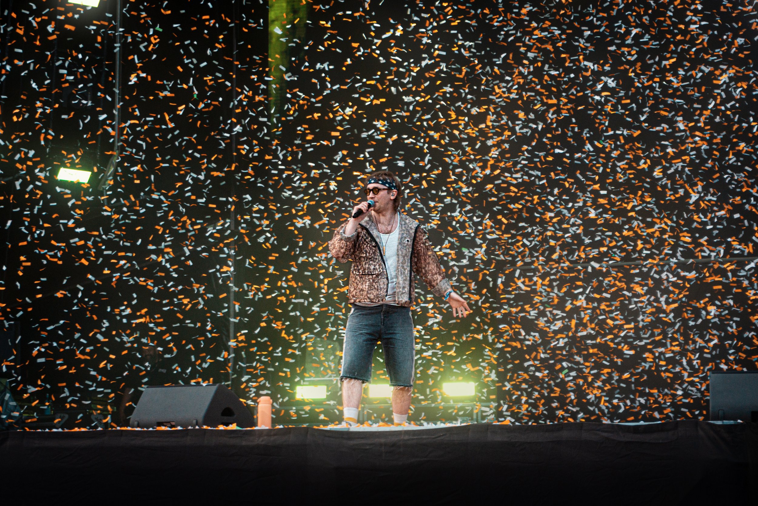Festival crowd in a confetti drop